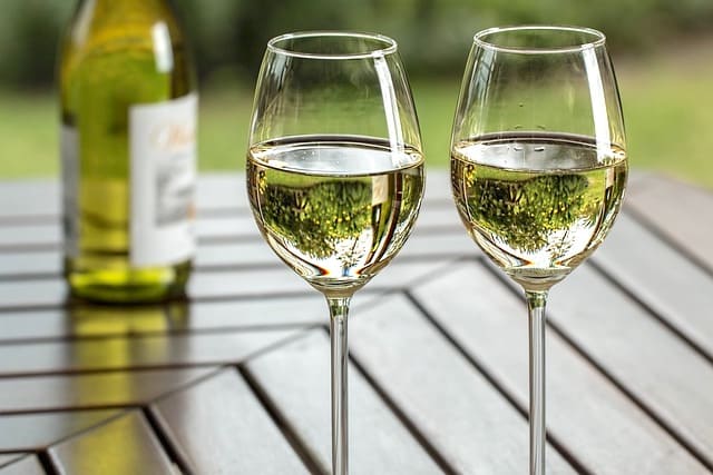 glasses of white wine on patio table