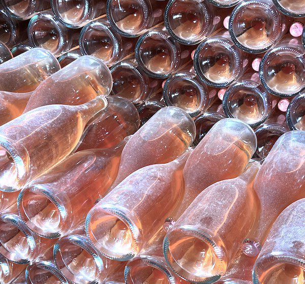wine bottles in wine cellar, aging wine