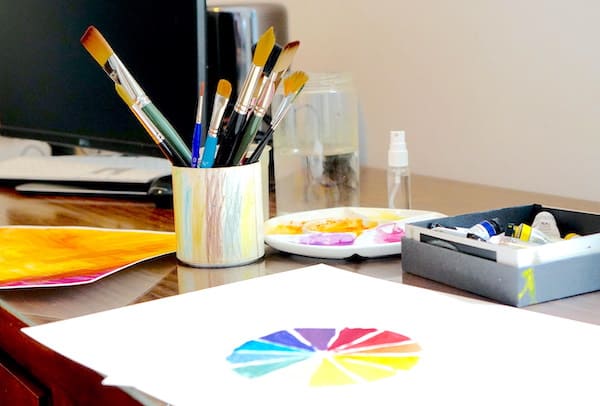 inside my art studio, brushes, paper, color wheel